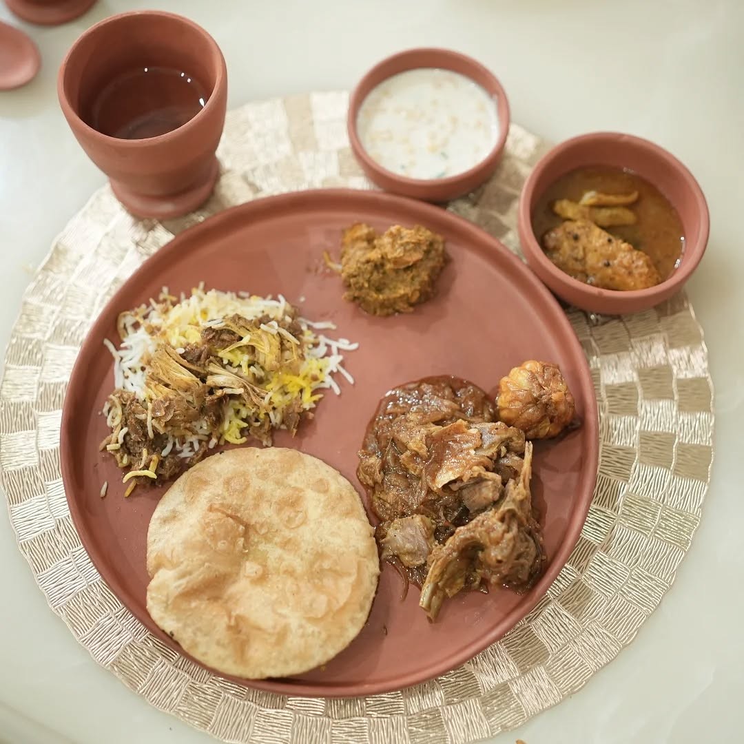 Community diners sampling authentic Ahuna mutton